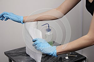 hands of a tattoo artist. Sterility and safety.  Disposable rubber gloves and disposable towels