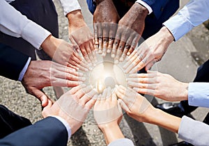 Hands, teamwork or top view of business people outside in collaboration for mission goals in city. Light, link or