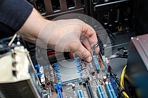 Hands of technician installing HDD