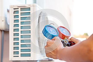 The hands of Technician are using a measuring tool.