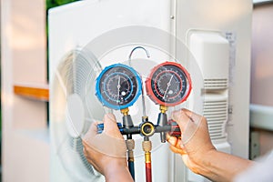 The hands of Technician are using a measuring tool.