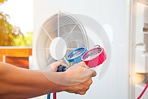 Hands of Technician are using a measuring tool.