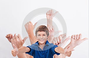 Hands of teenagers showing okay sign on white