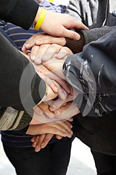 Hands of teens together. union