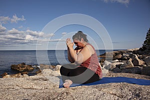 Hands at third eye in yoga