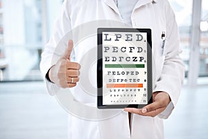 Hands thumbs up, tablet screen and eye chart in hospital for vision examination in clinic. Healthcare, snellen