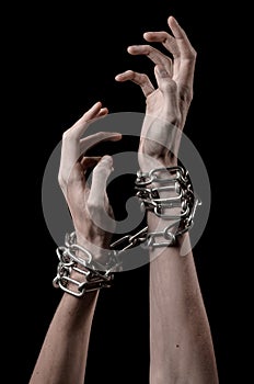 Hands tied chain, kidnapping, dependence, loneliness, social problem, halloween theme, black background