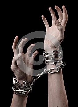 Hands tied chain, kidnapping, dependence, loneliness, social problem, halloween theme, black background