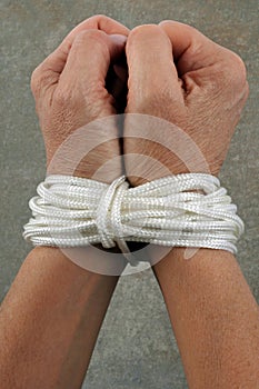 Hands tied up with a rope