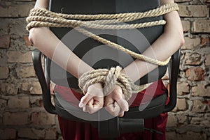 Hands tied up with rope