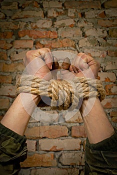 Hands tied up with rope