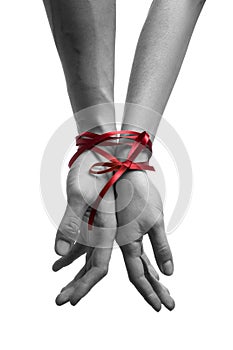 Hands tieing with ribbon