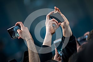 Hands to the skies of people in the concert