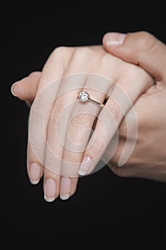 Hands Together With Woman's Engagement Ring