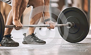 hands of trainer lifting a heavy barbell. Bodybuilder ready to lift weights cropped. Muscular athlete ready to workout