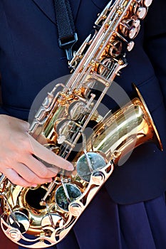 Hands on a trumpet close up.