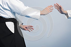 Hands of two girls standing in stance on martial