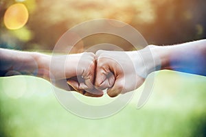 Hands of two man people fist bump team teamwork and partnership business success