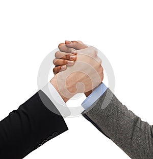 Hands of two people armwrestling