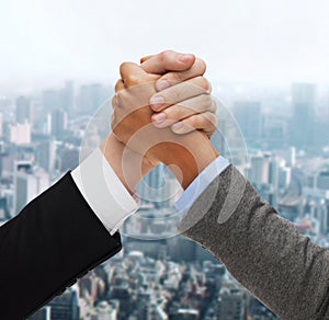 Hands of two people armwrestling