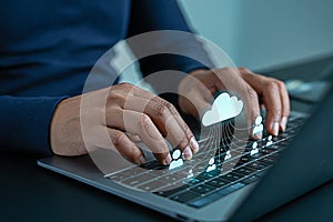 Hands typing on a laptop with cloud computing and networking icons for data transfer and connection