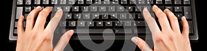 Hands Typing on Black Computer Keyboard