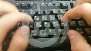 Hands typing on black keyboard, sending business e-mail, message
