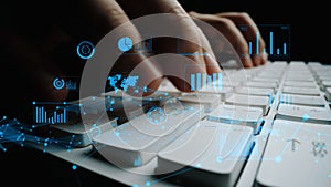 Hands Typing on a Computer Keyboard with Digital Graphs and Data Visualizations Representing Analytics, Technology, and