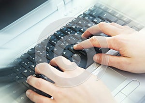 Hands Typing on Computer Keyboard at Office