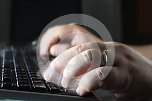 Hands typing on the keyboard