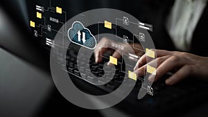 Hands Typing on Keyboard with Cloud Computing Graphics Representing File Management and Data Storage Visualization in