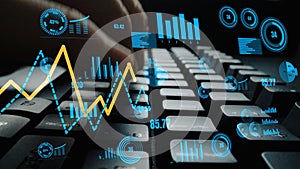 Hands Typing on Keyboard with Graphs, Charts, and Data Visualizations in Background Representing Analytics, Technology