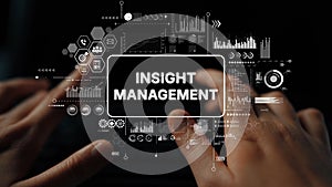 Hands Typing on a Keyboard with Insight Management Concept and Data Visualization Elements on Screen. Asymptotic smart