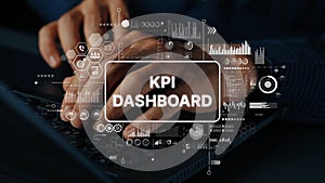 Hands Typing on Keyboard with KPI Dashboard Graphics and Analytics Elements Displayed on Screen for Data Analysis