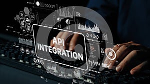 Hands Typing on Keyboard with Overlay Interface for API Integration and Data Analysis in Technology Environment