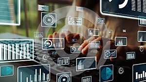 Hands Typing on Keyboard Surrounded by Data Visualizations and Graphs in Modern Digital Workspace with Analytical