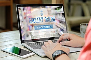 Hands typing laptop computer with grocery shopping online on screen background, business and technology, lifestyle concept