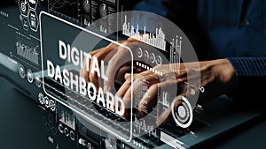 Hands Typing on Laptop with Digital Dashboard and Data Visualization Elements in Modern Workspace Environment