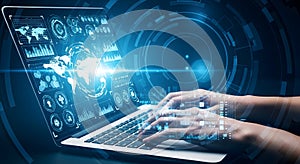Hands typing on laptop with digital data analytics and global network visualization