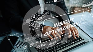 Hands typing on laptop with digital interface showing data analytics, business insights, and performance optimization