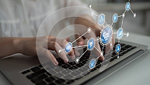 Hands Typing on Laptop with Digital Technology Icons Representing Cloud Computing, Data Analysis, and Modern