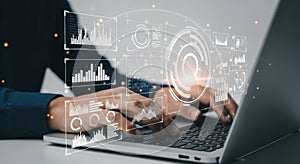 Hands typing on laptop with futuristic digital data overlays and glowing analytics interface