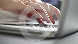 Hands typing on laptop keyboard. Close-up of busy manager businesswoman working online sitting in home office on