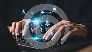 Person Working on Laptop with Digital Network and Cloud Computing Interface.