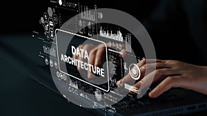 Hands typing on laptop keyboard with futuristic data architecture interface and digital graphs for technology and