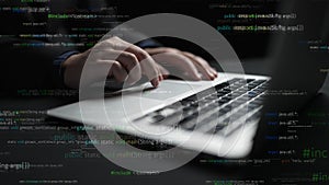 Hands Typing on Laptop Keyboard Surrounded by Lines of Code in a Dark Environment Representing Programming and Software