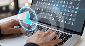 Hands typing on laptop screen displaying network of people connection and user profile