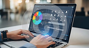 Person working on a laptop displaying a colorful data visualization and user interface design