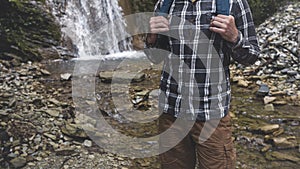 Hands Unrecognizable Man Holds Backpack Strap On Waterfall Background Hiking Journey Travel Trek Concept