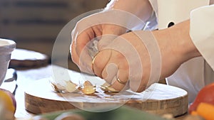 Hands Unwrap A Garlic Slow Motion